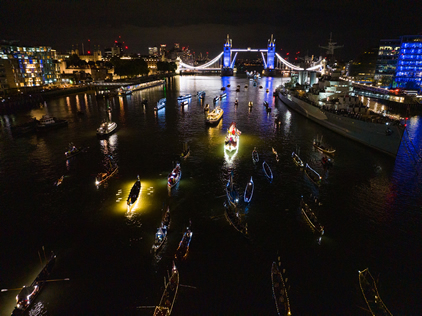 The rowers passing HMS Belfast